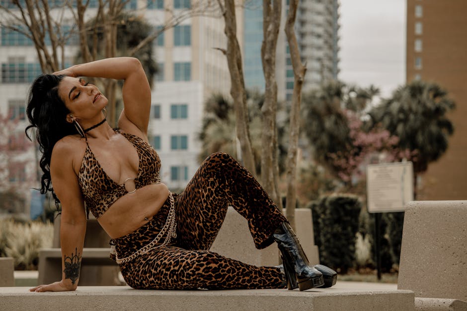 Woman in leopard print clothing posing outdoors in a city environment, Tampa, FL.